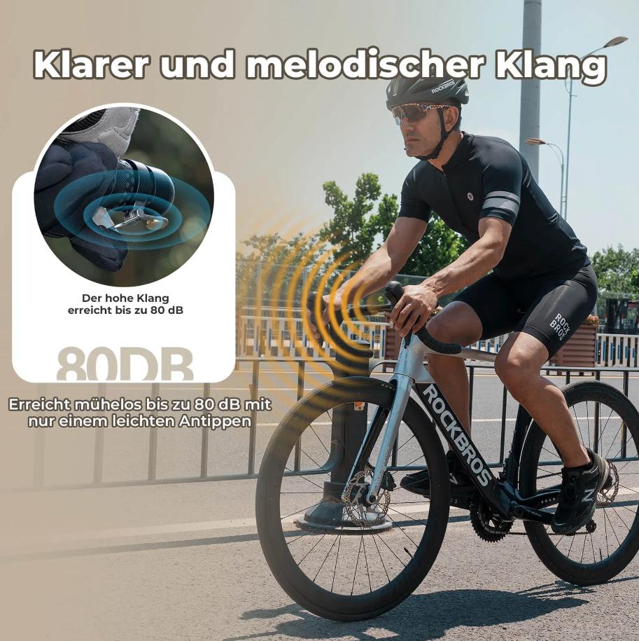 ROCKBROS campana para bicicleta con sonido claro mostrando su uso por un hombre montando bicicleta